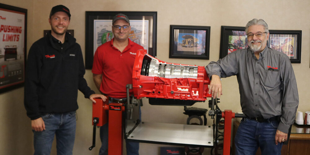 Marketing manager Nick Trucone, his father Dan, and Irvin Gers with a display transmission cutaway. Dan and Irv are responsible for new aftermarket products developed by the company.